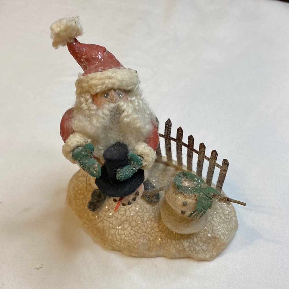 Andy Faye. Santa builds snowman.